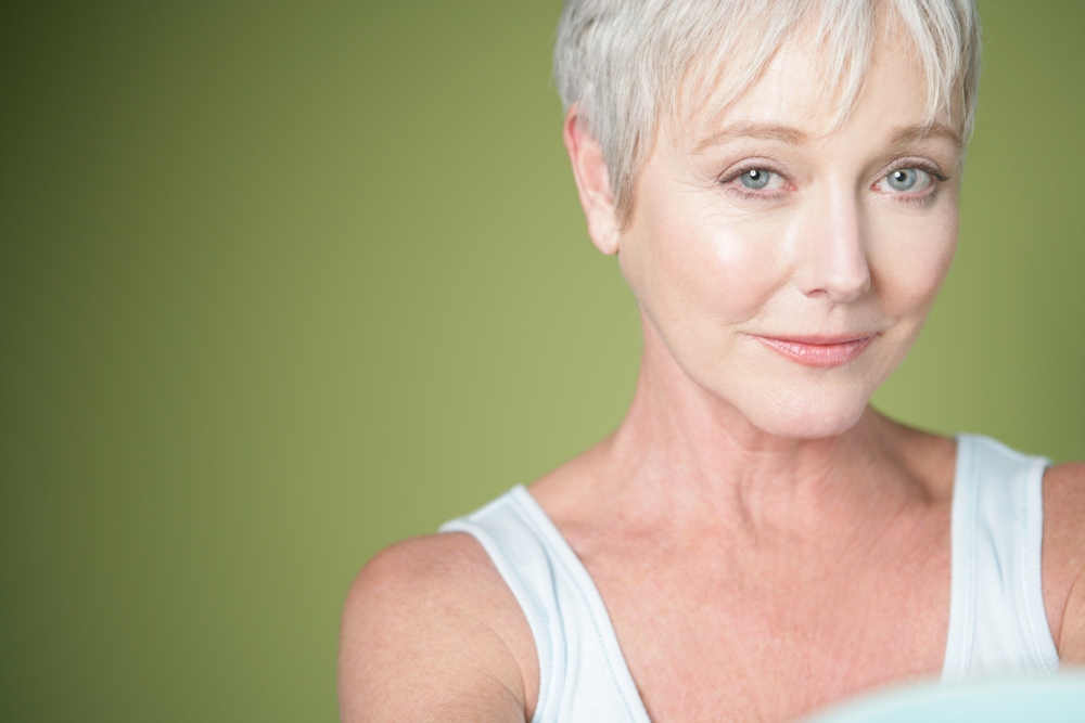 older woman on green background