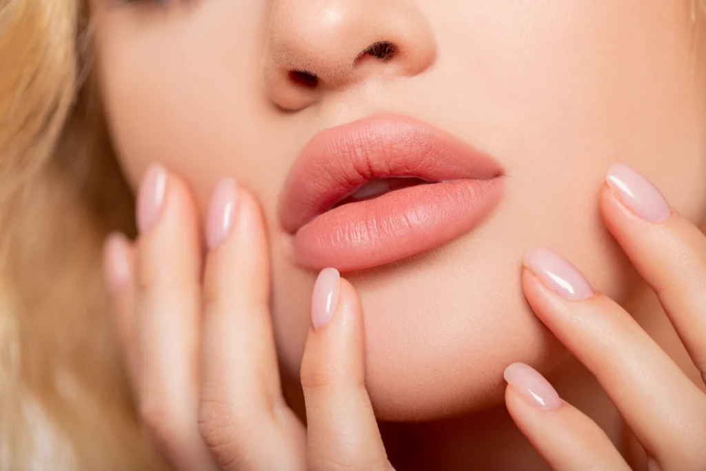 A close-up of plump, hydrated lips with a smooth and natural-looking finish after a Juvederm filler treatment.