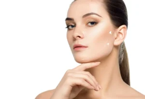 Woman faces forward with dotted arrows over the cheek and jawline indicating facial lift directions.